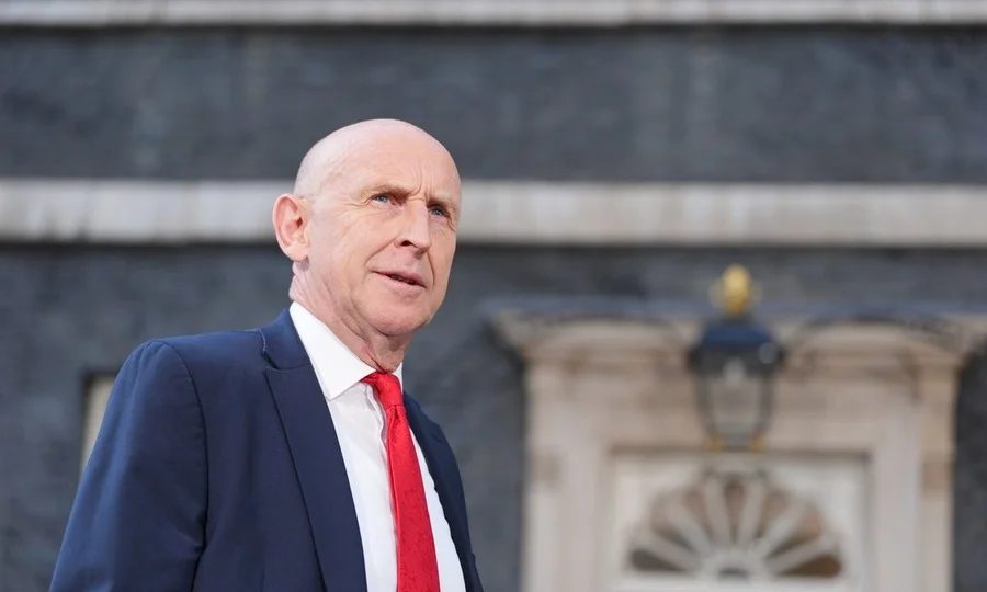John Healey delivering speech